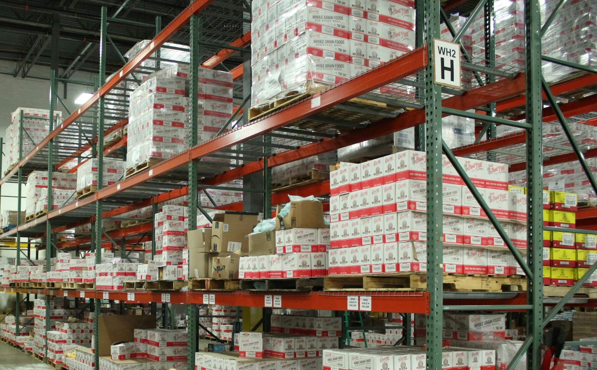 Labeled warehouse shelving with standardized storage locations