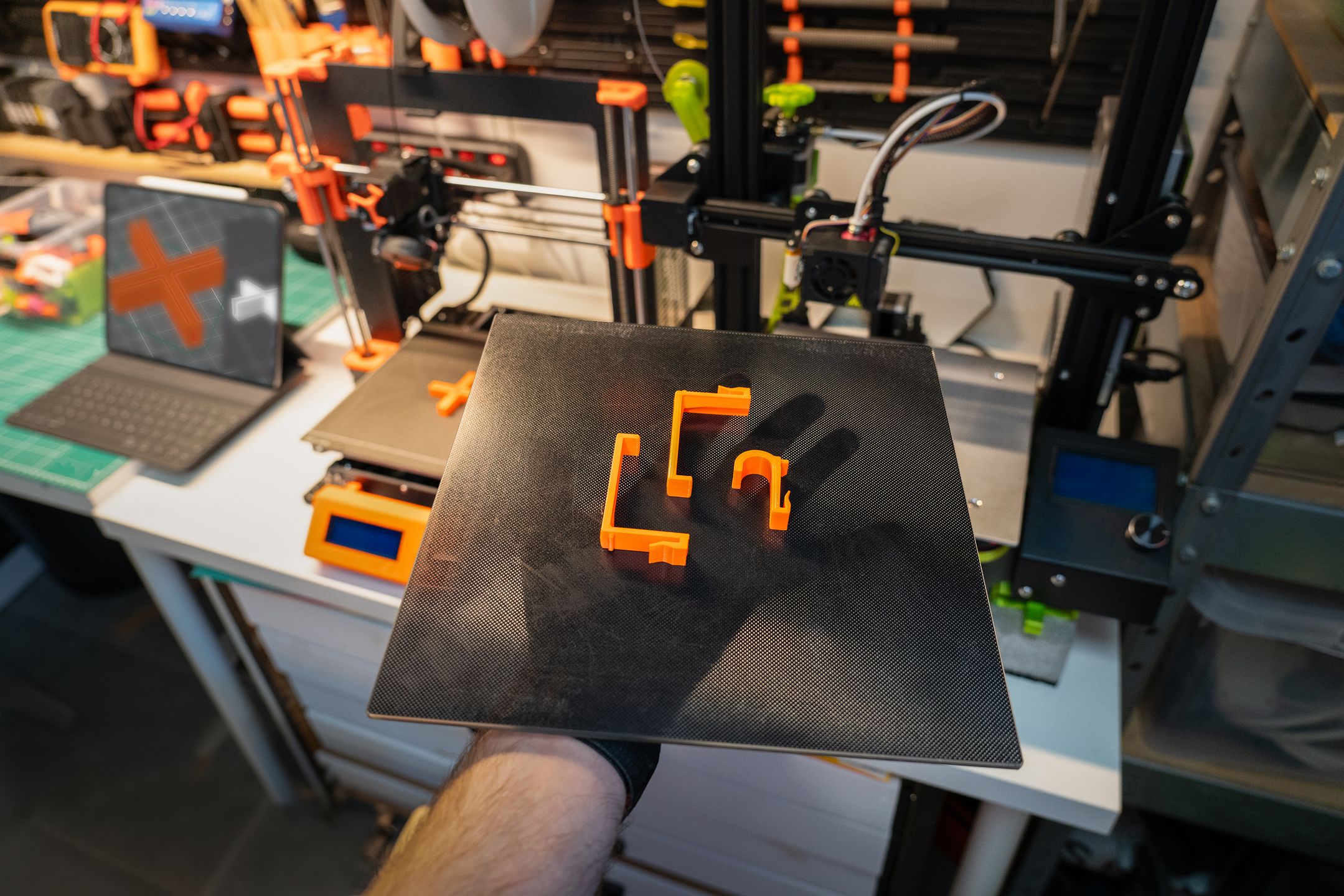 Engineer inspecting a 3D printed part