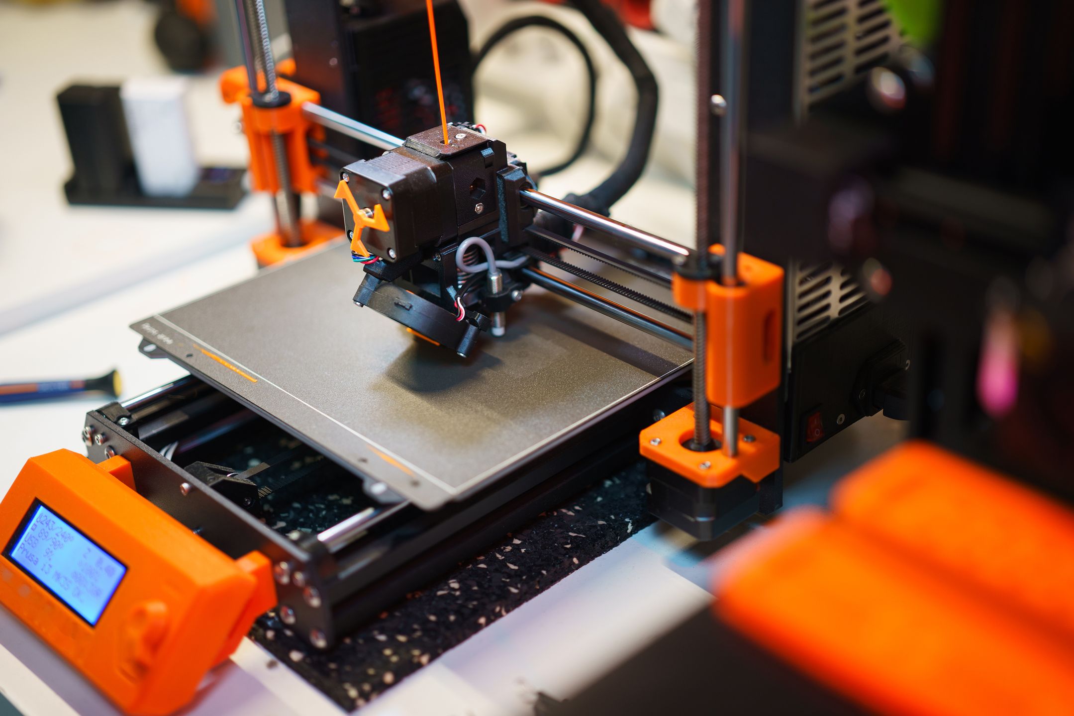 Hybrid manufacturing machine combining additive and CNC processes