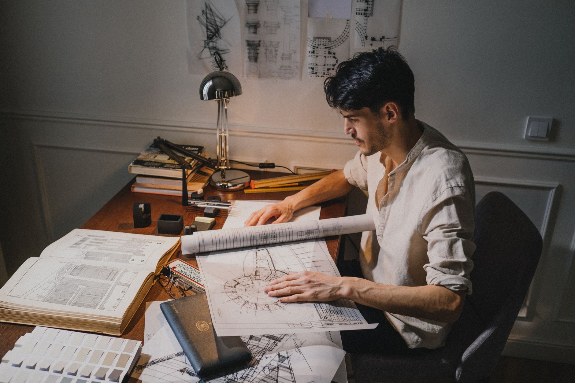 Engineer reviewing design specifications at a workstation