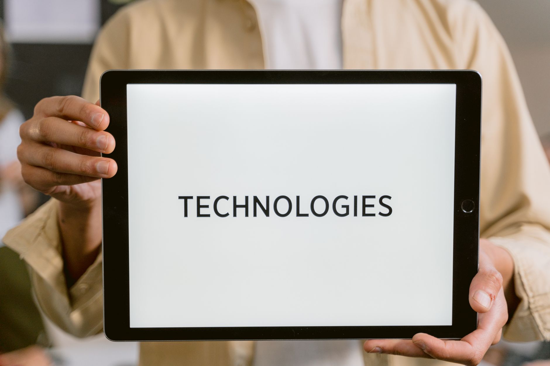 Technician scanning equipment with a tablet for AR overlay