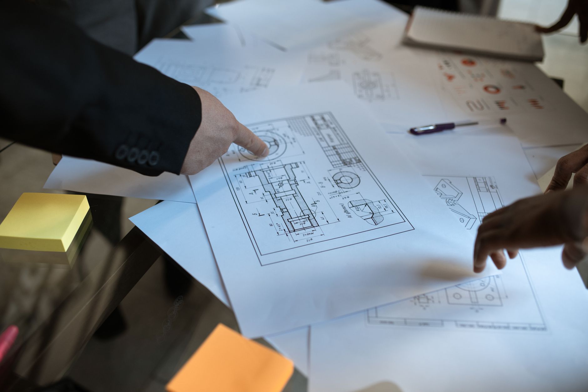 Engineer reviewing drawing callouts against a checklist