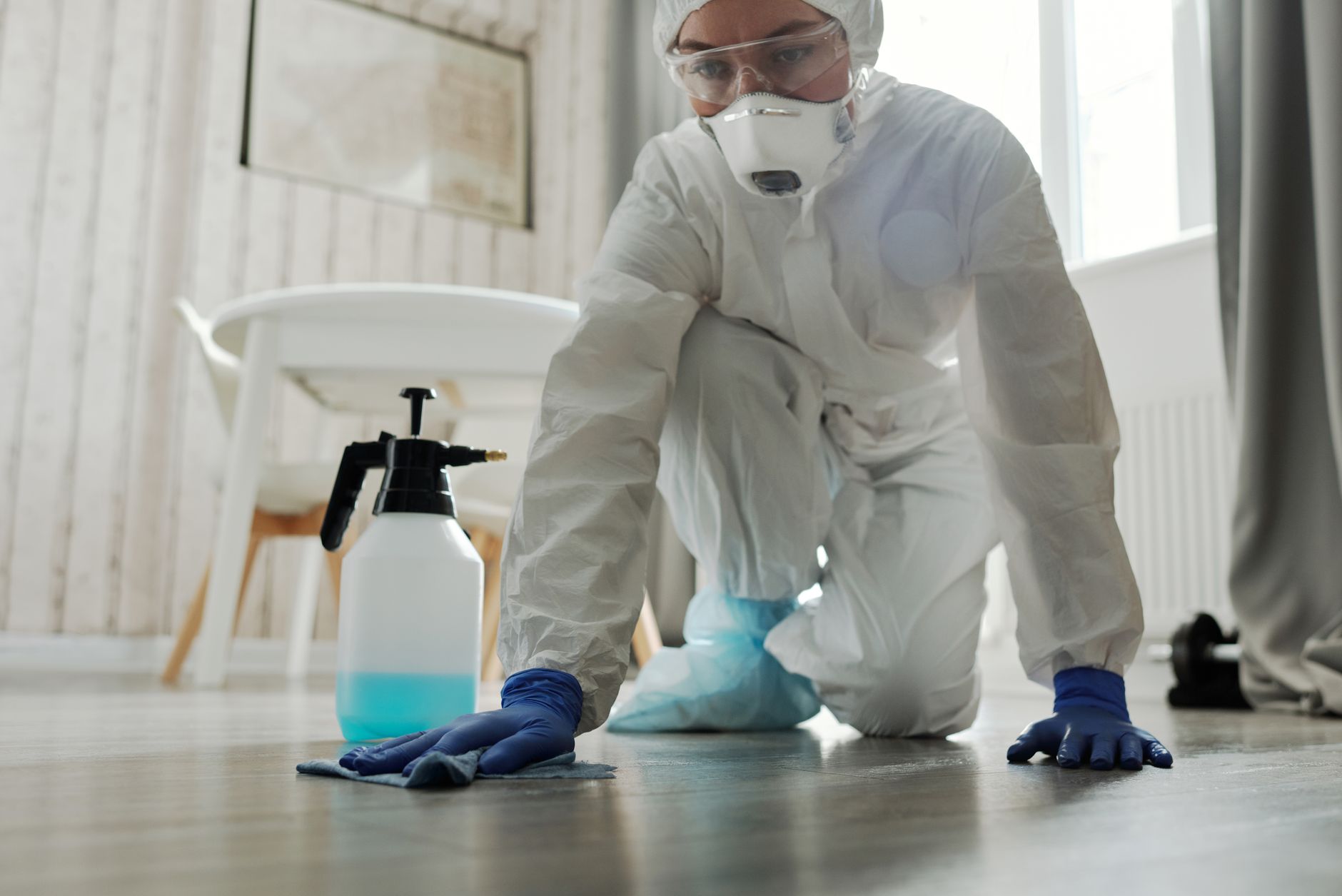 Worker using a bloodborne pathogen cleanup kit