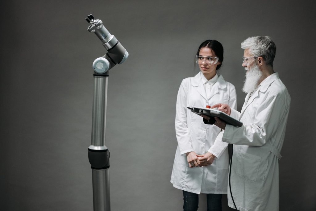 Collaborative robot arm working alongside a human worker