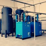 Industrial air compressor unit in a factory