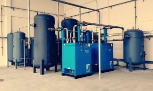 Industrial air compressor unit in a factory