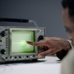 Quality engineer analyzing process data on a screen