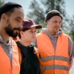 Team of factory workers standing together