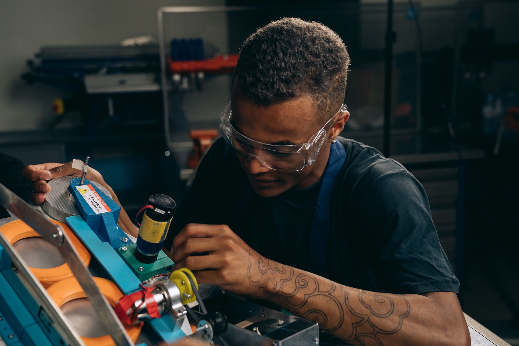 Engineer adjusting machinery with precision in an industrial setting