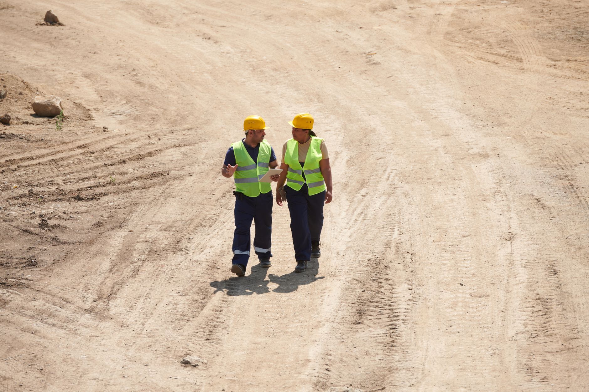 Workers evacuating a manufacturing facility during an emergency drill