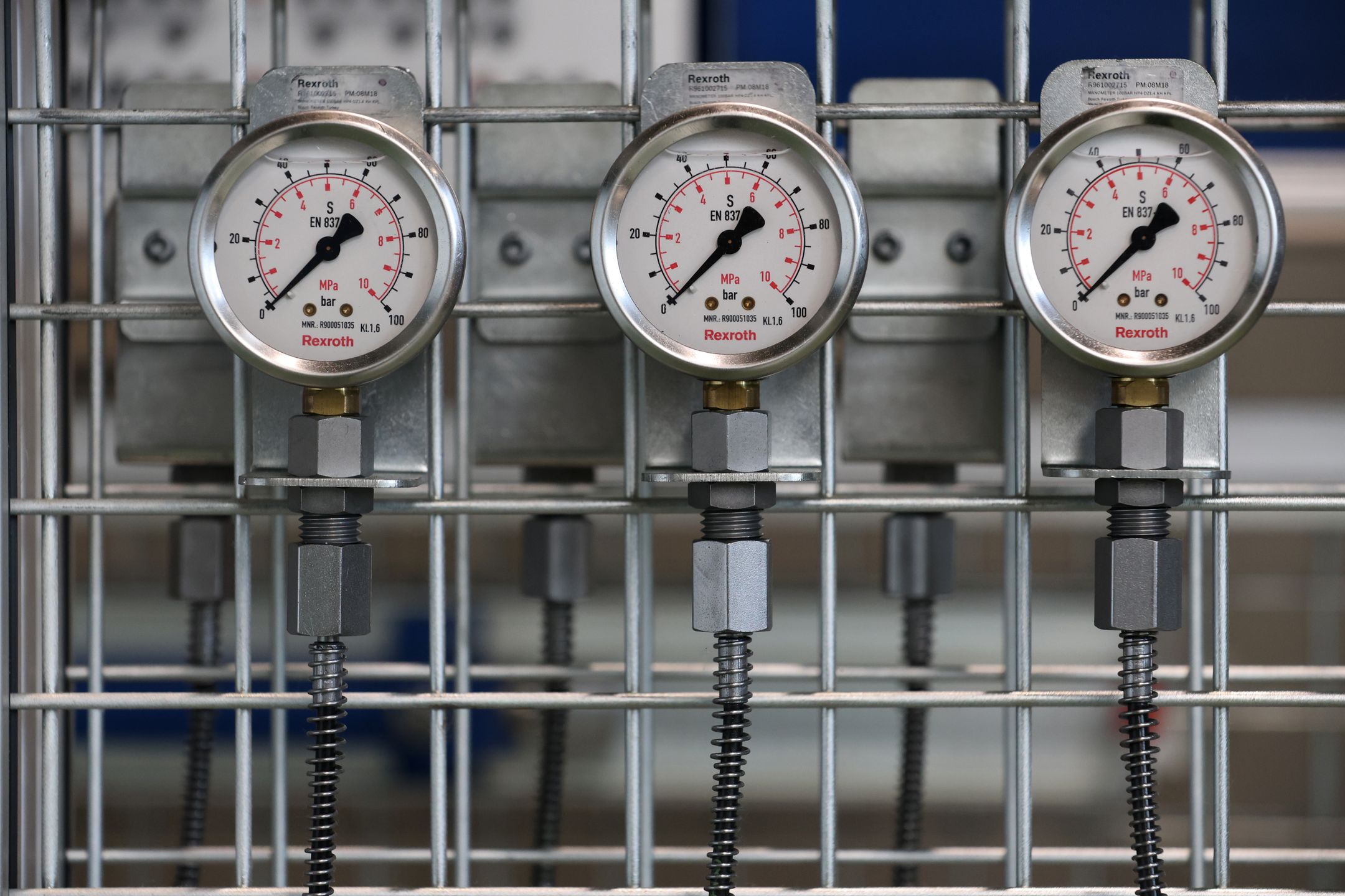 Technician troubleshooting an industrial control panel