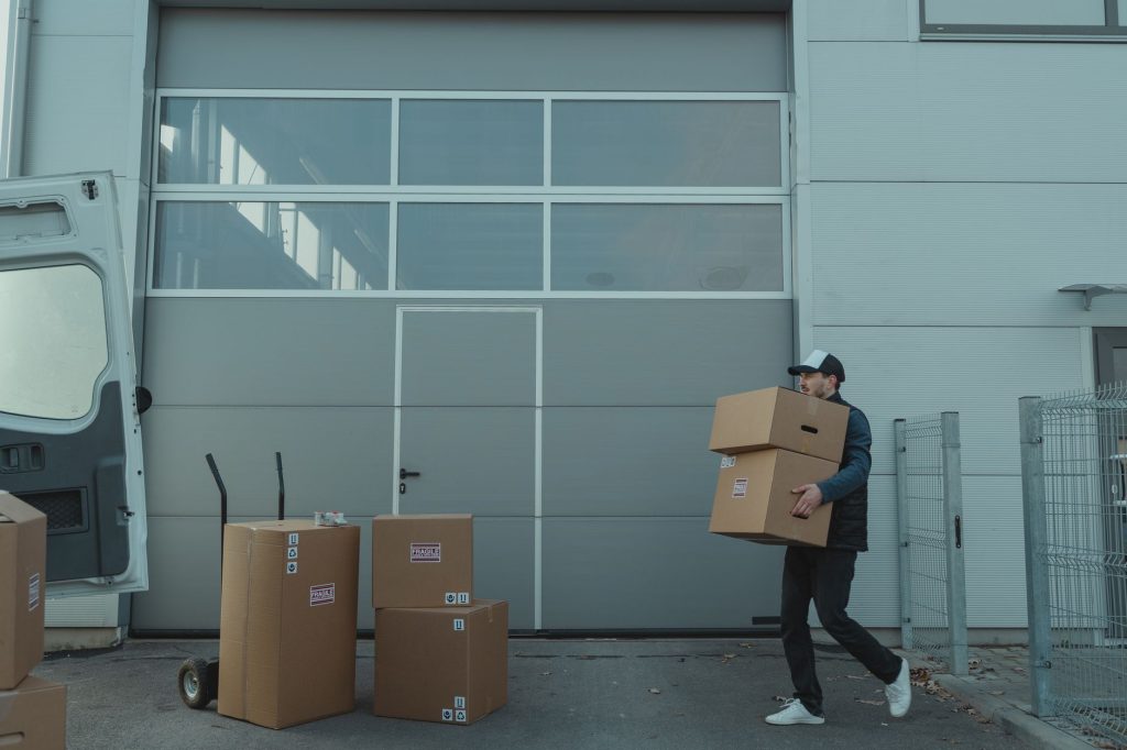 Worker lifting a box using proper lifting technique