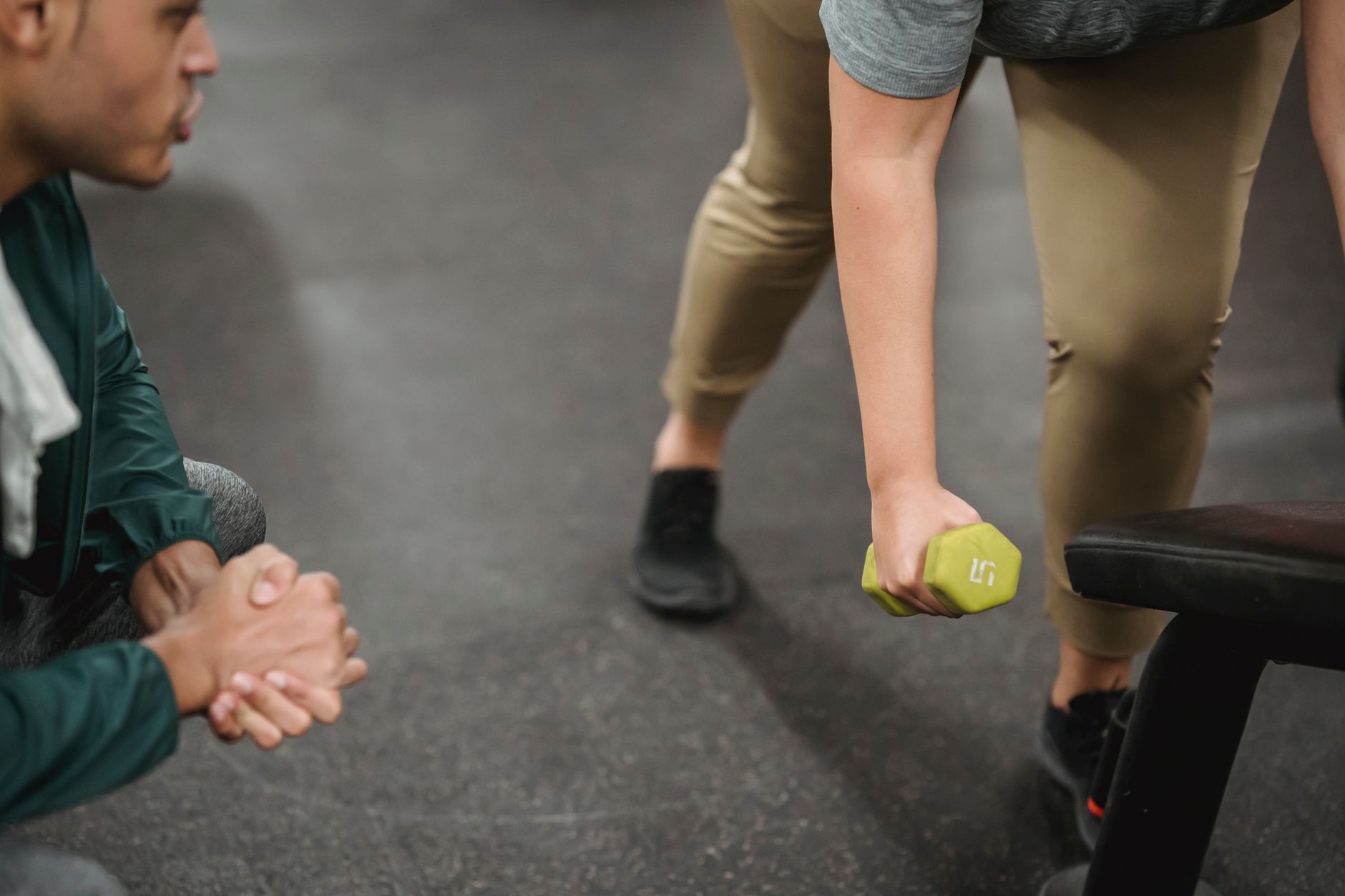 Instructor demonstrating proper lifting technique to trainees