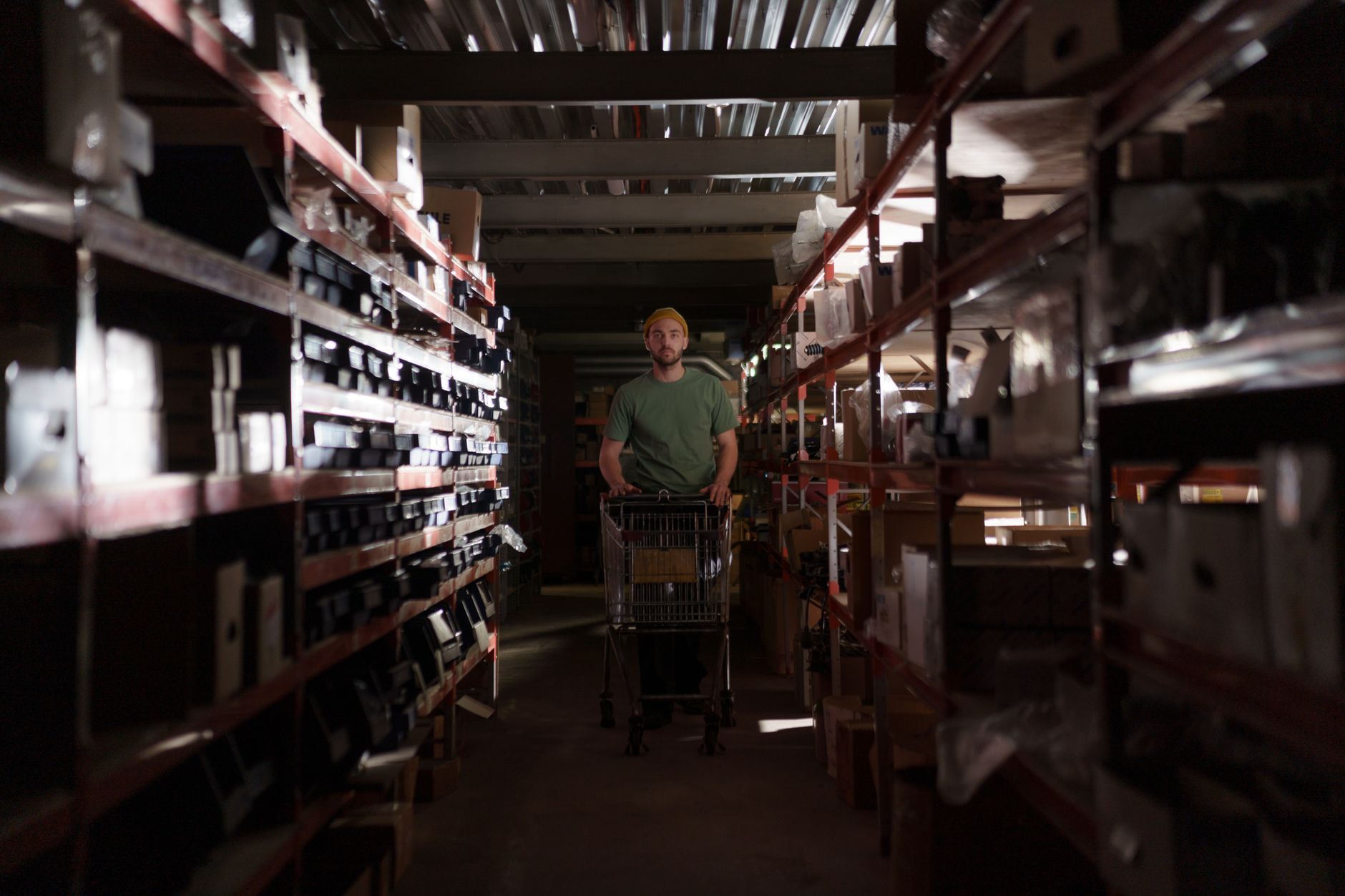 Worker using a cart to reduce manual lifting