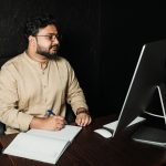 Production planner reviewing an ERP order schedule