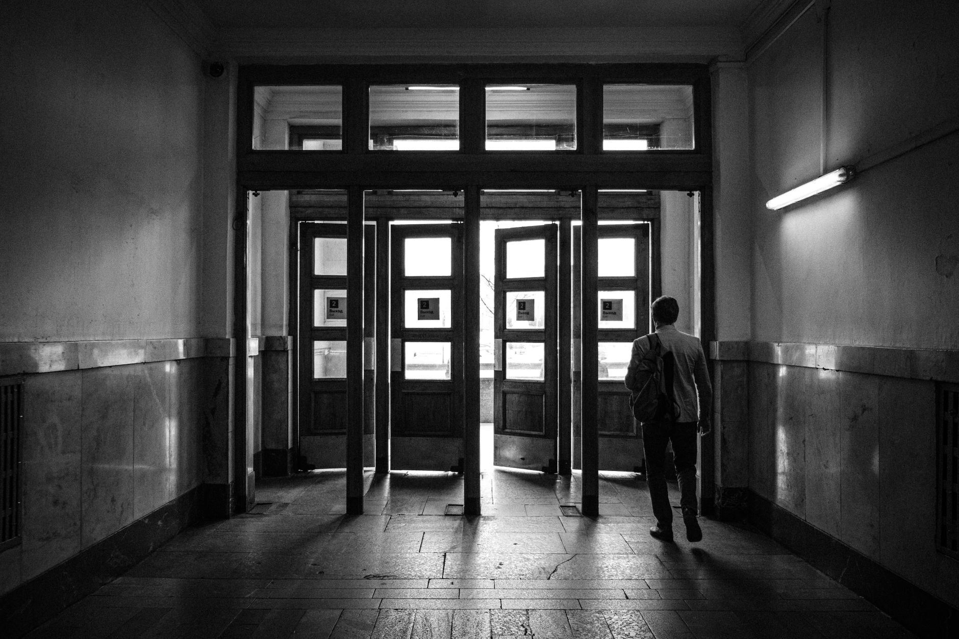 Worker evacuating through a hallway during a fire drill