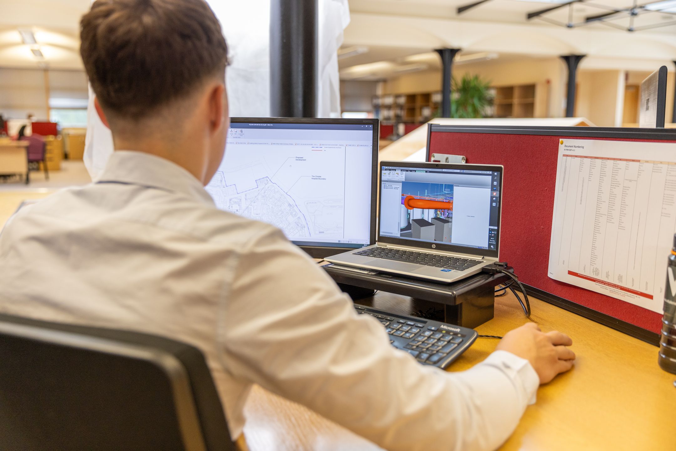 Engineer designing tooling on a CAD workstation