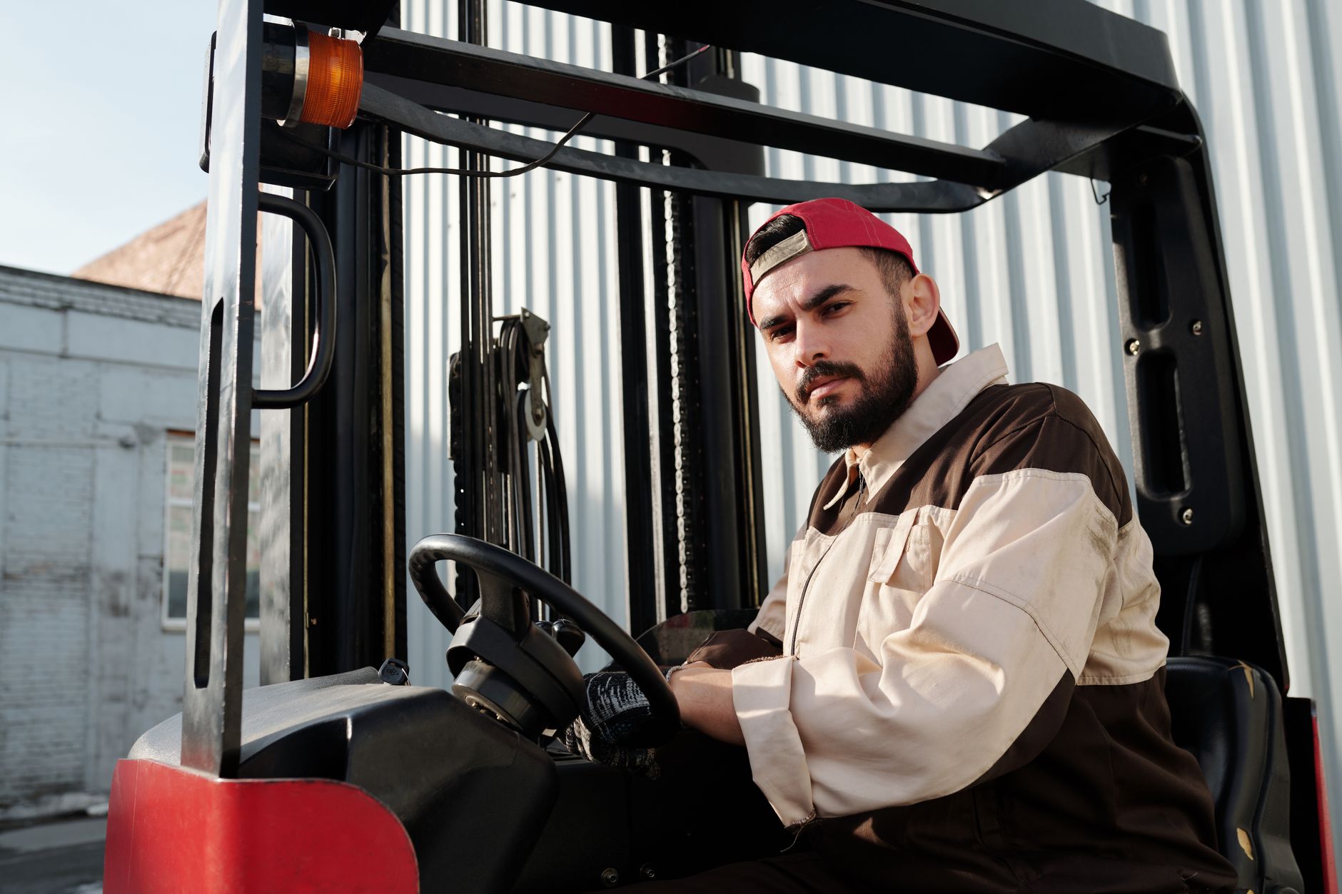 Forklift operator conducting a pre-shift inspection