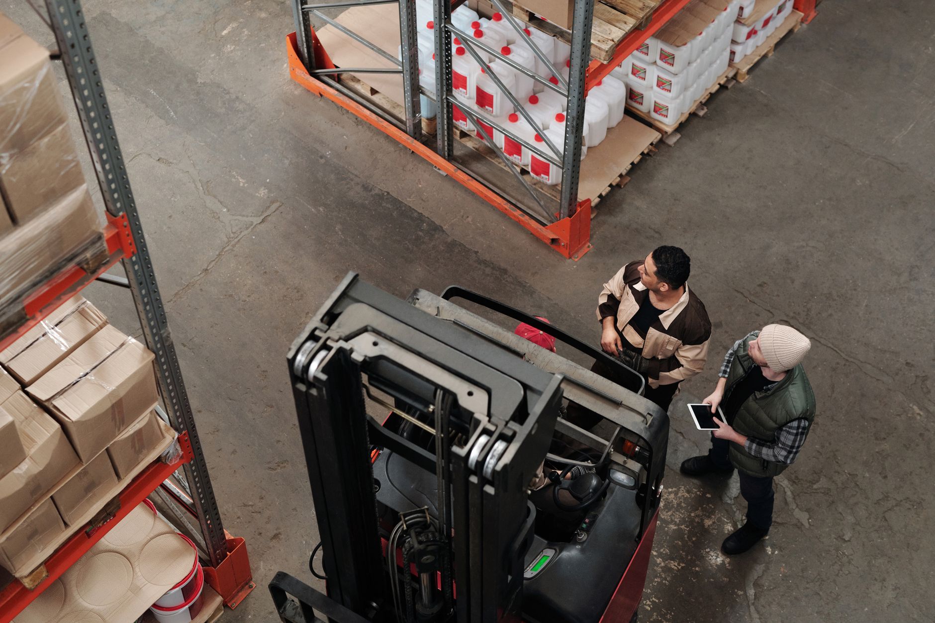 Supervisor evaluating a forklift operator's performance