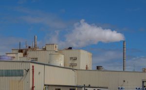 Factory exterior with emissions monitoring equipment