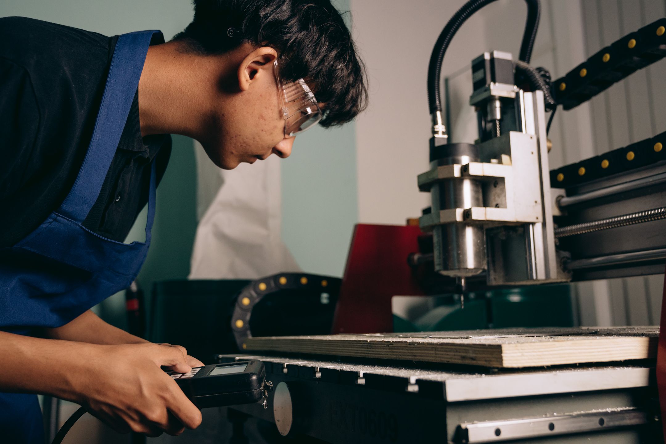 Worker near industrial electrical equipment
