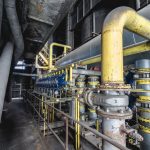 Industrial piping and valves in a batch processing facility