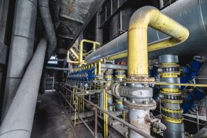 Industrial piping and valves in a batch processing facility