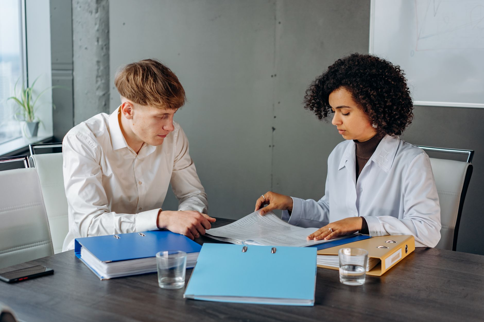 Auditor reviewing quality records against procedure requirements