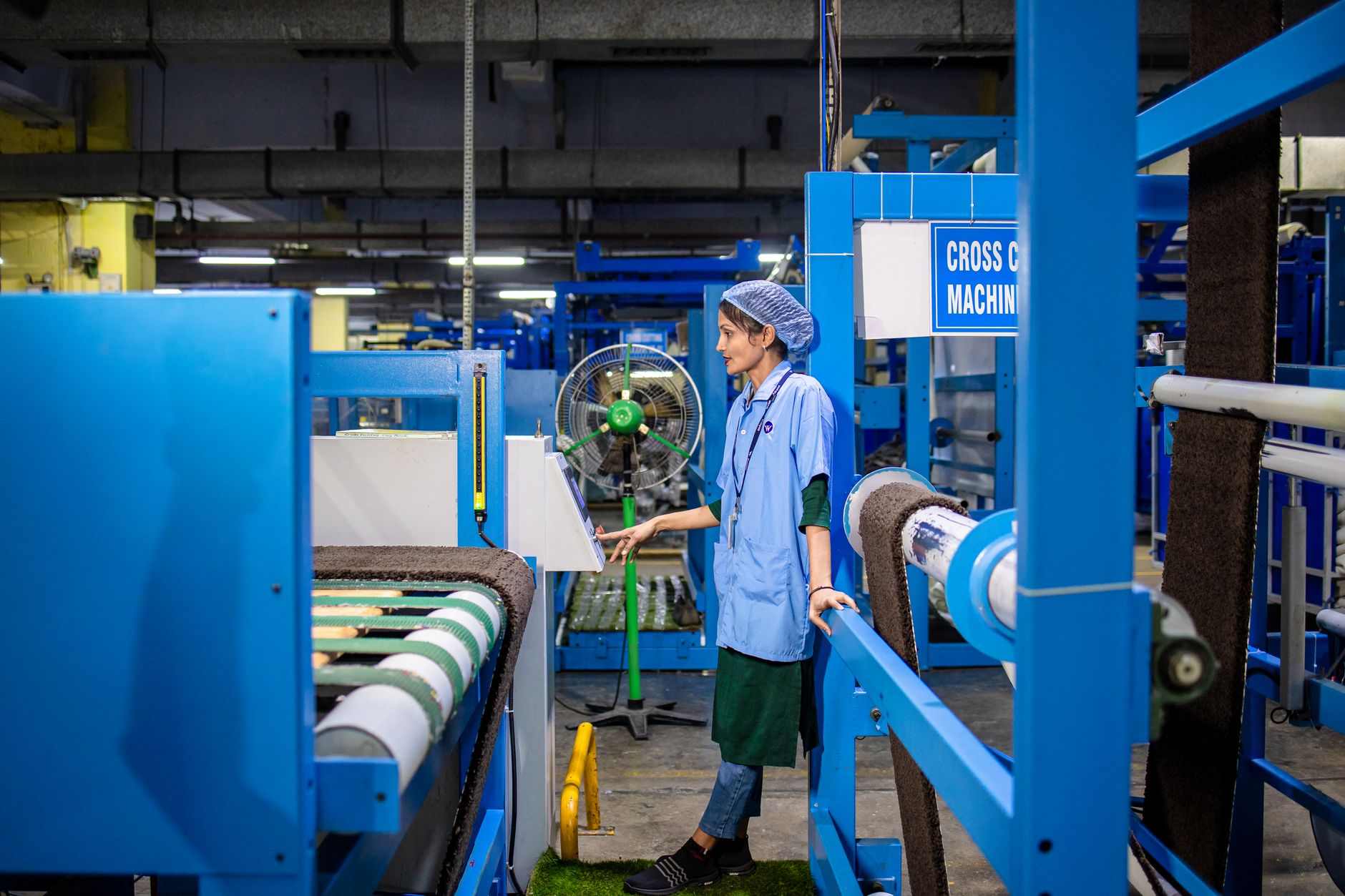 Technician inspecting a stopped production line after an abnormality