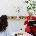 Manager mentoring an employee in an office setting
