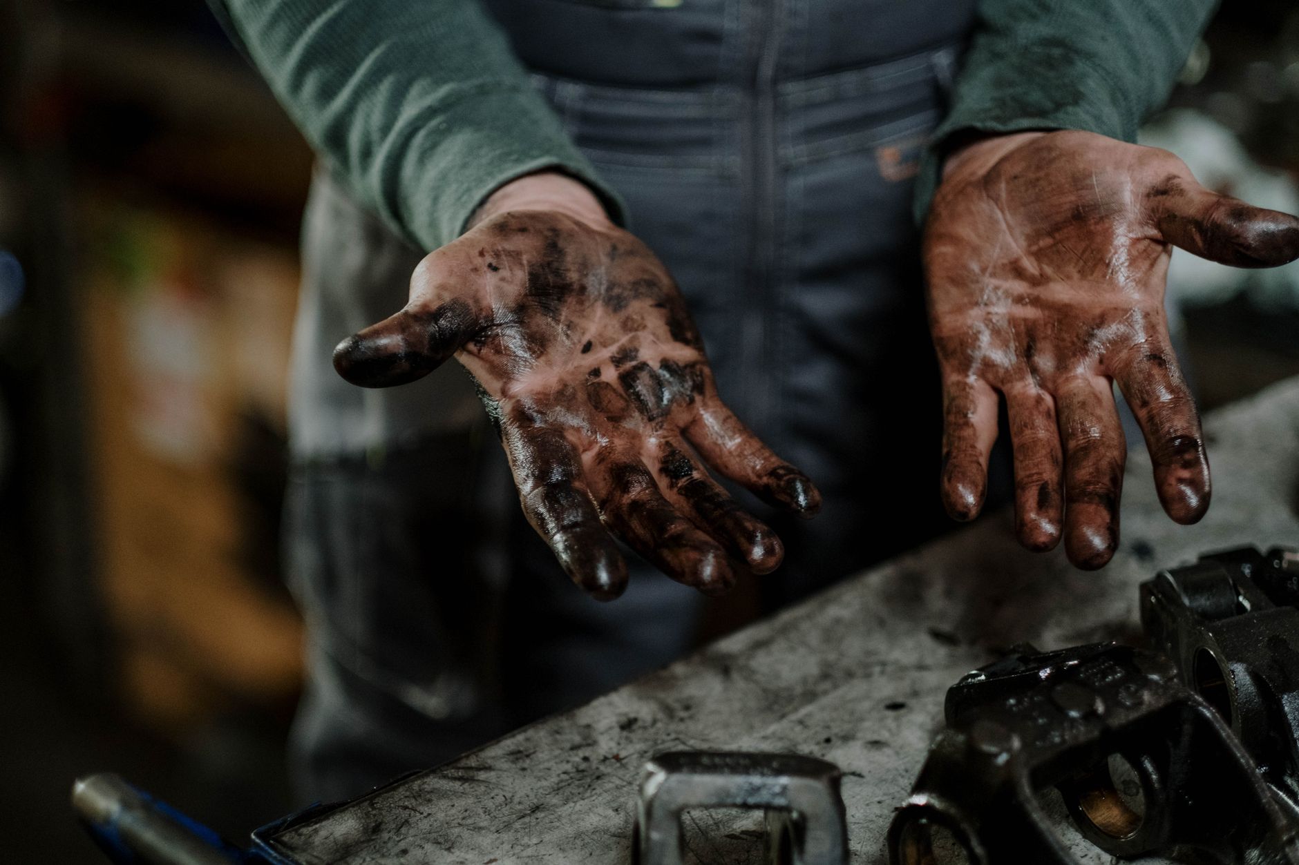 Technician applying grease to an industrial bearing