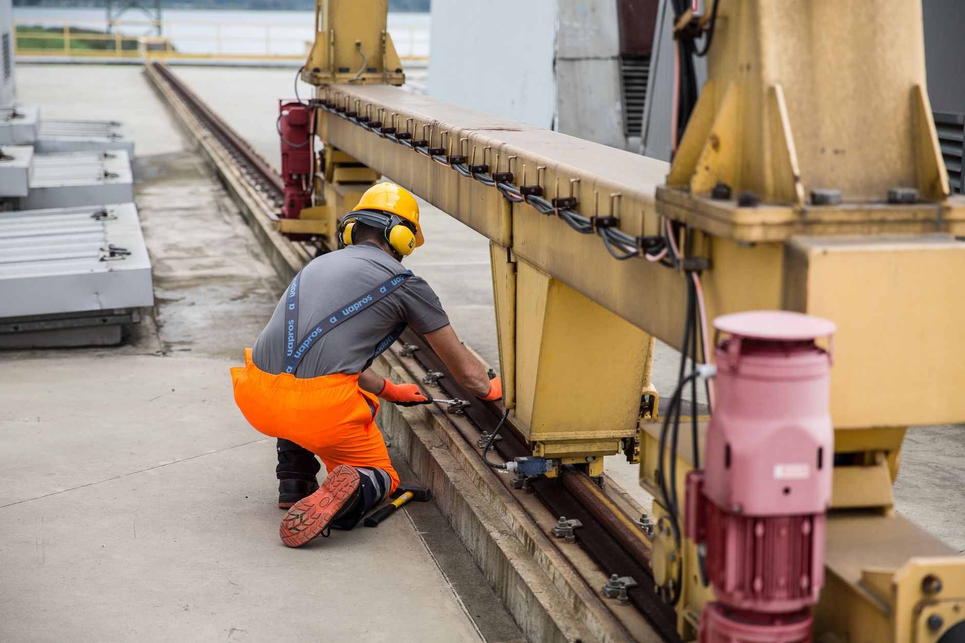 Technician installing a safety guard on a press
