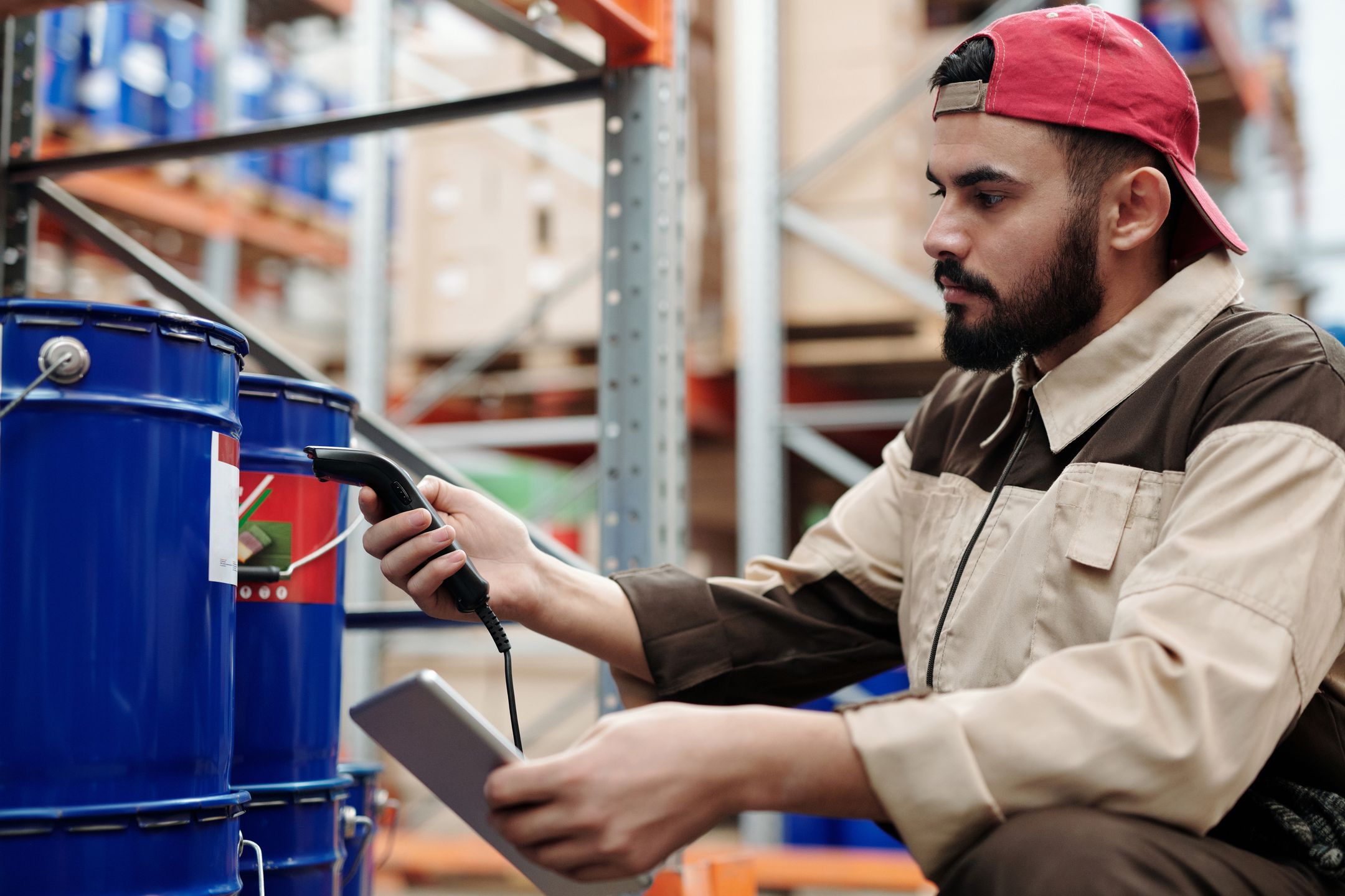 Warehouse worker scanning items with a tablet