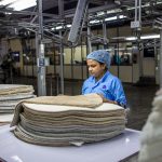New manufacturing worker receiving training on the shop floor