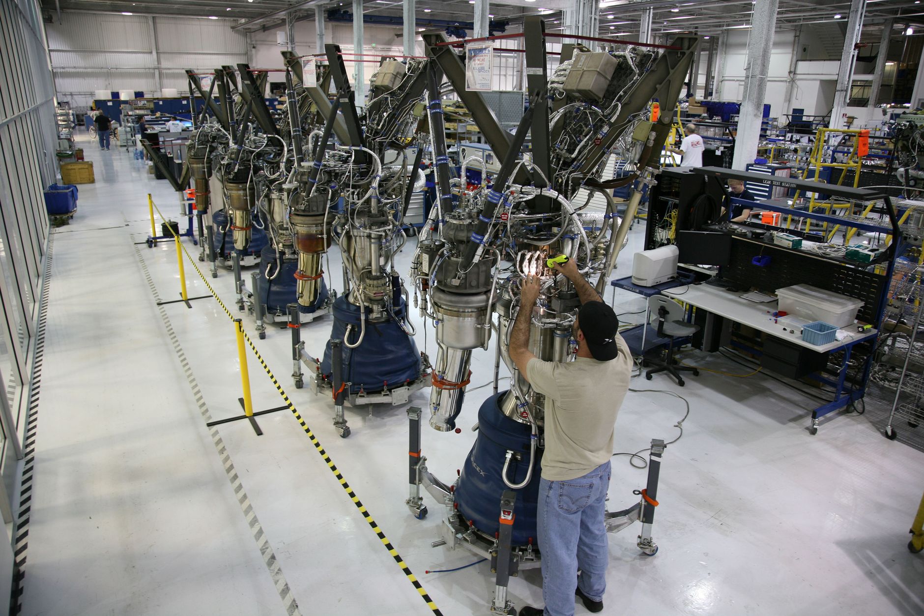 Technician inspecting an aerospace component using nondestructive testing