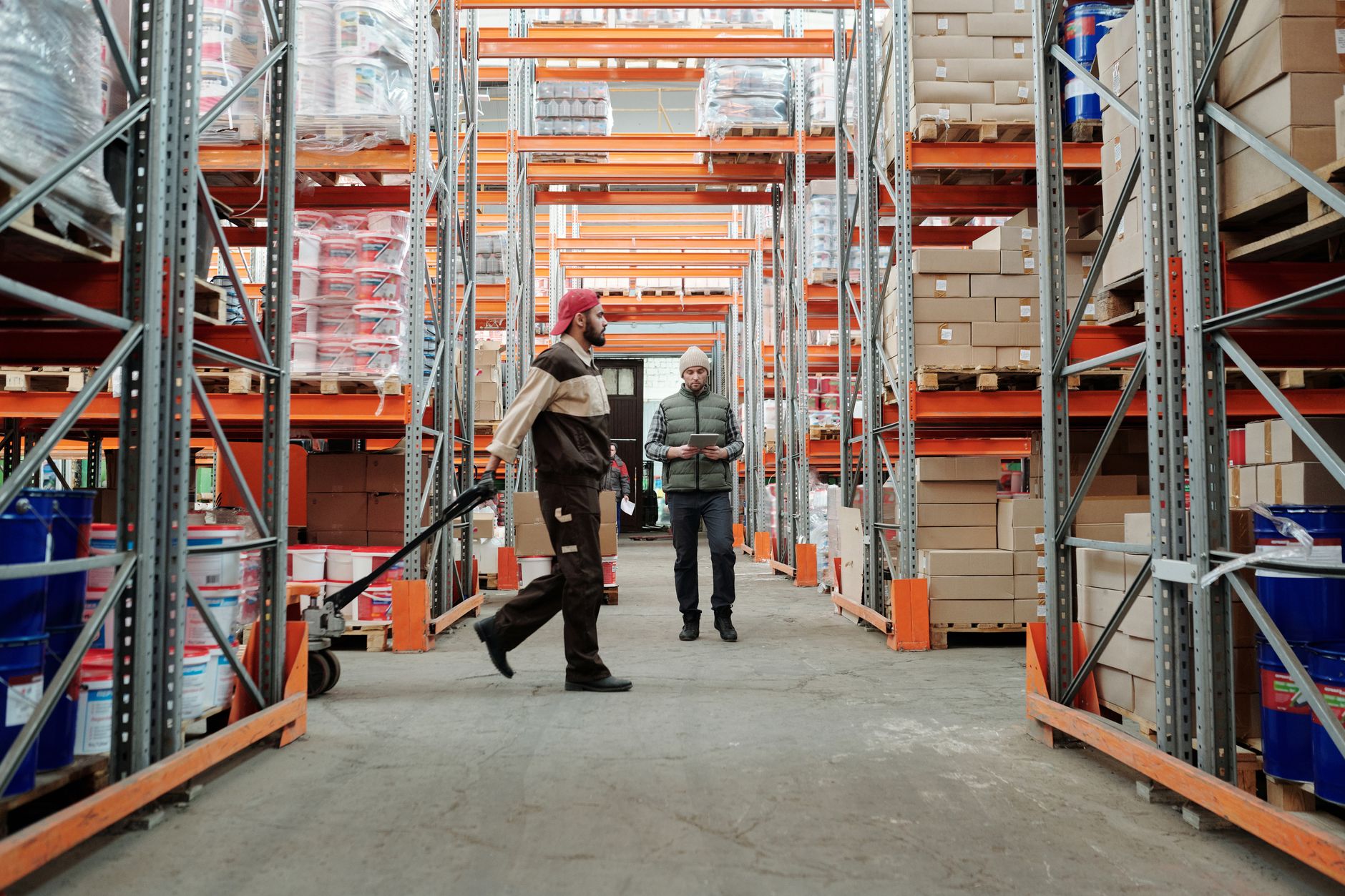 Supervisor coaching an employee on the production floor