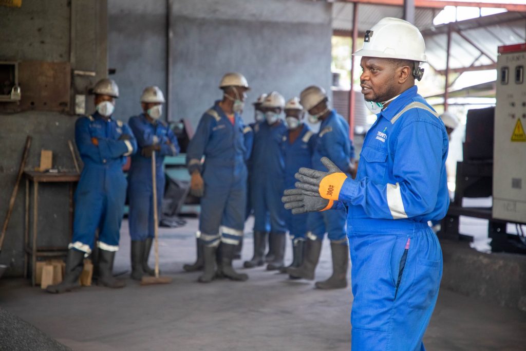 Group of workers receiving safety training indoors
