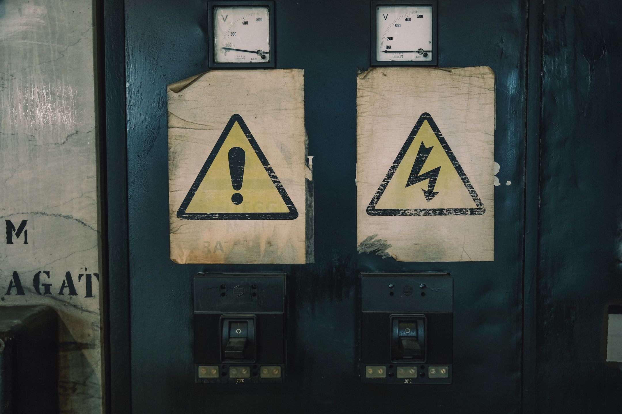 Industrial warning signage on an electrical panel