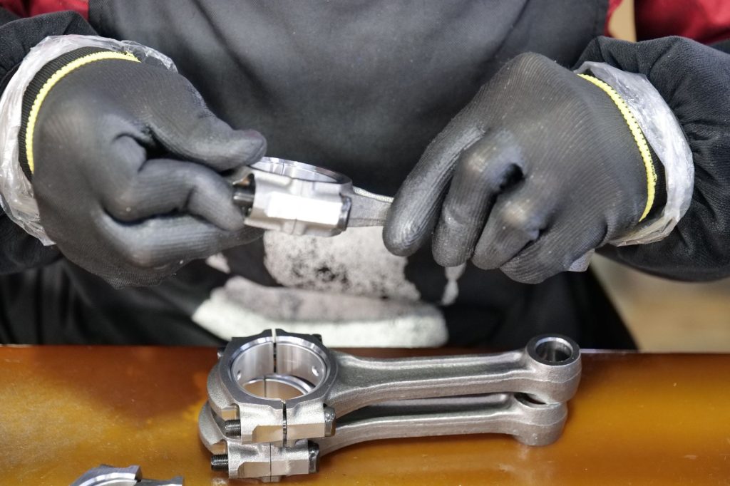 Automotive parts laid out for inspection on a workbench