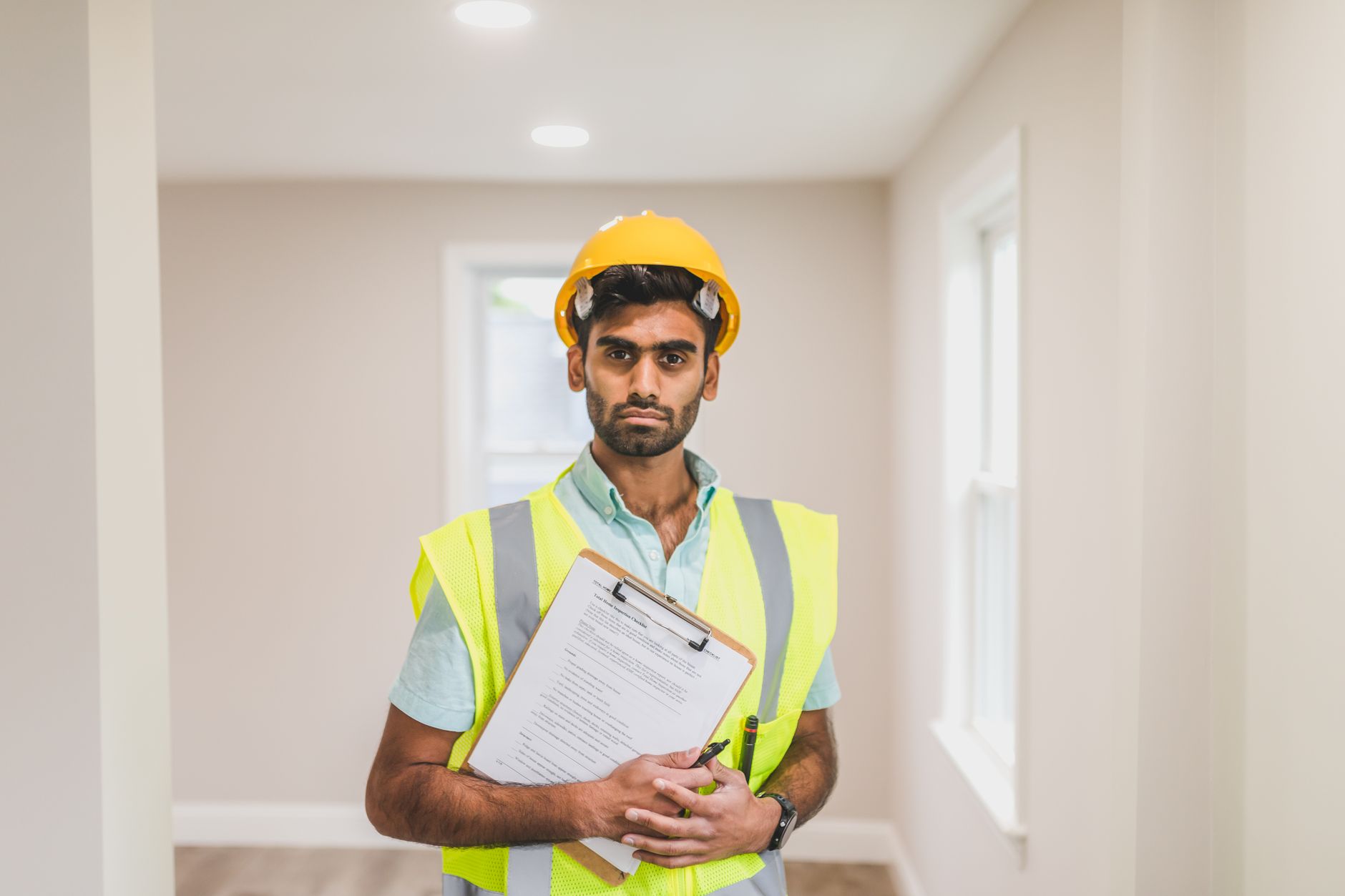 Supervisor conducting a workplace PPE hazard assessment