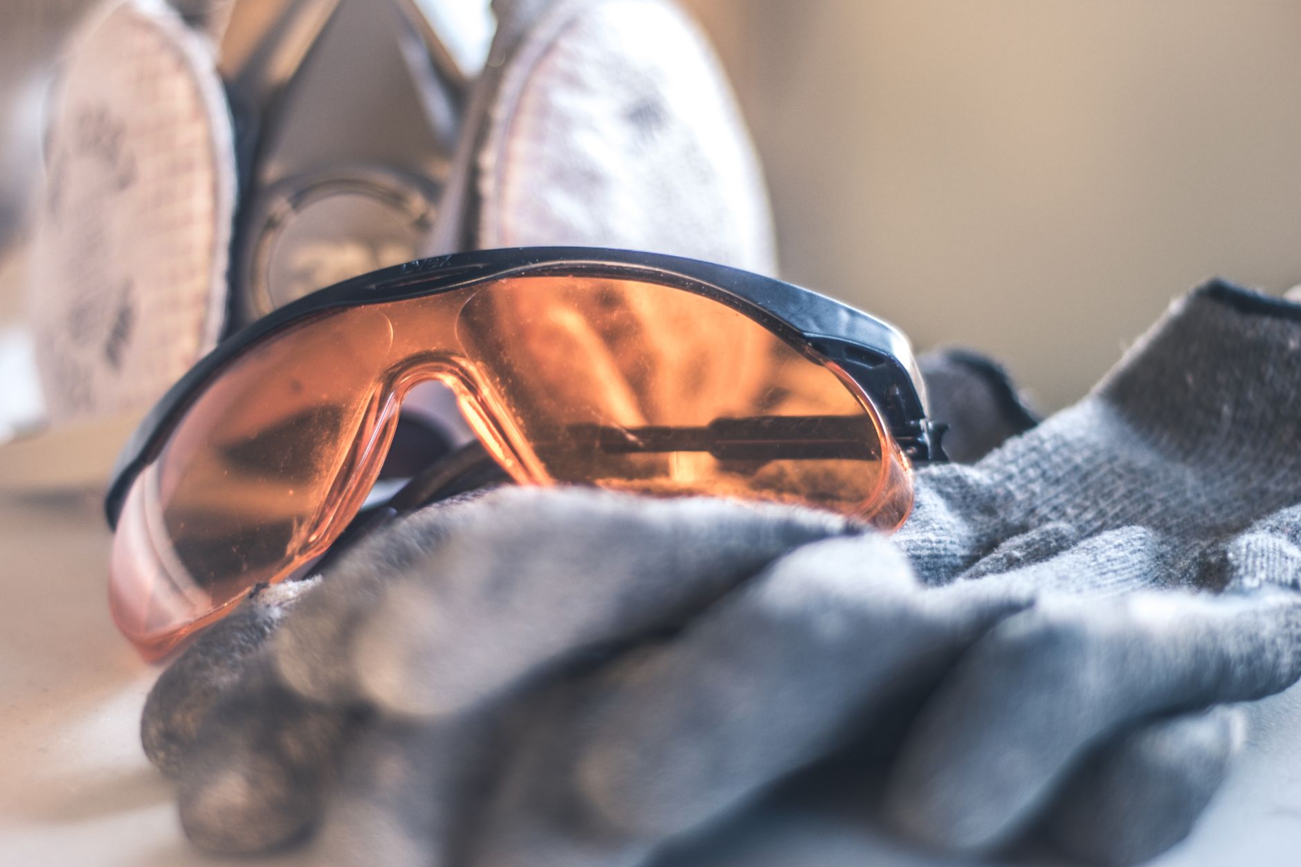 Worker selecting appropriate safety glasses from a supply station