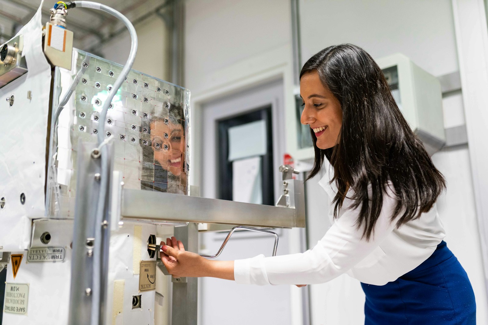 Technician performing precision equipment testing