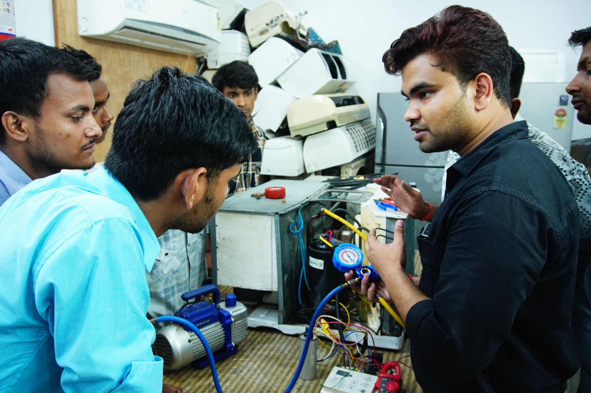 Instructor teaching centrifugal pump fundamentals to technicians