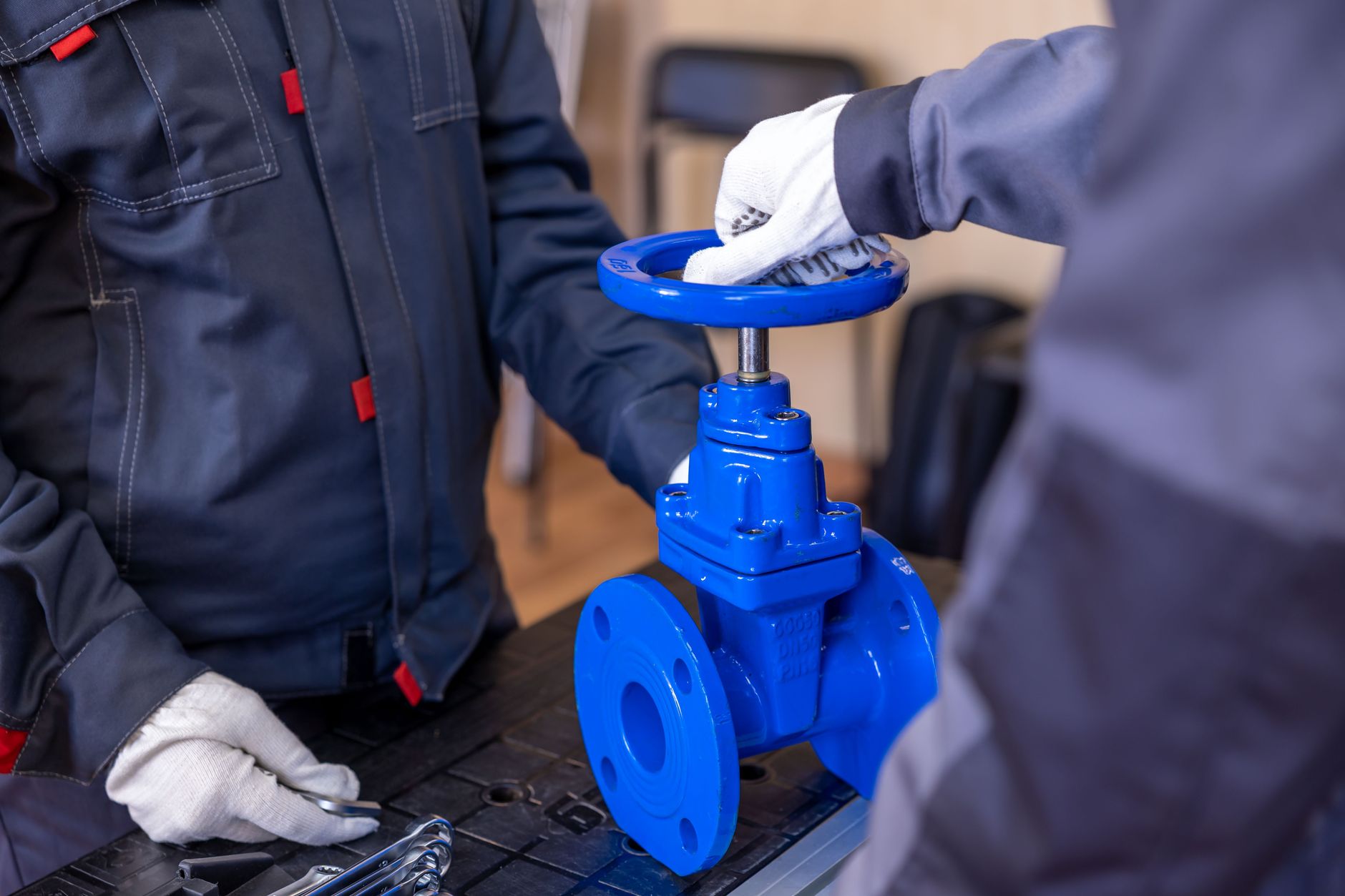 Technician inspecting a centrifugal pump in an industrial facility