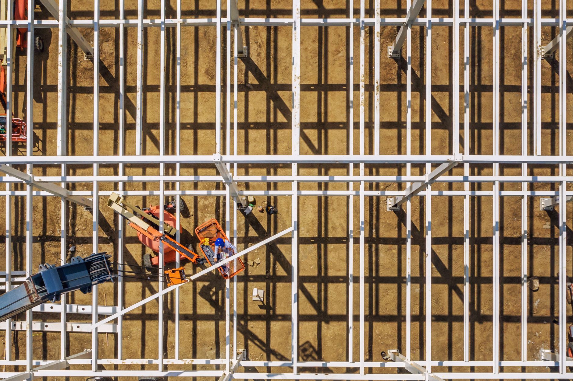 Construction workers building a new manufacturing facility
