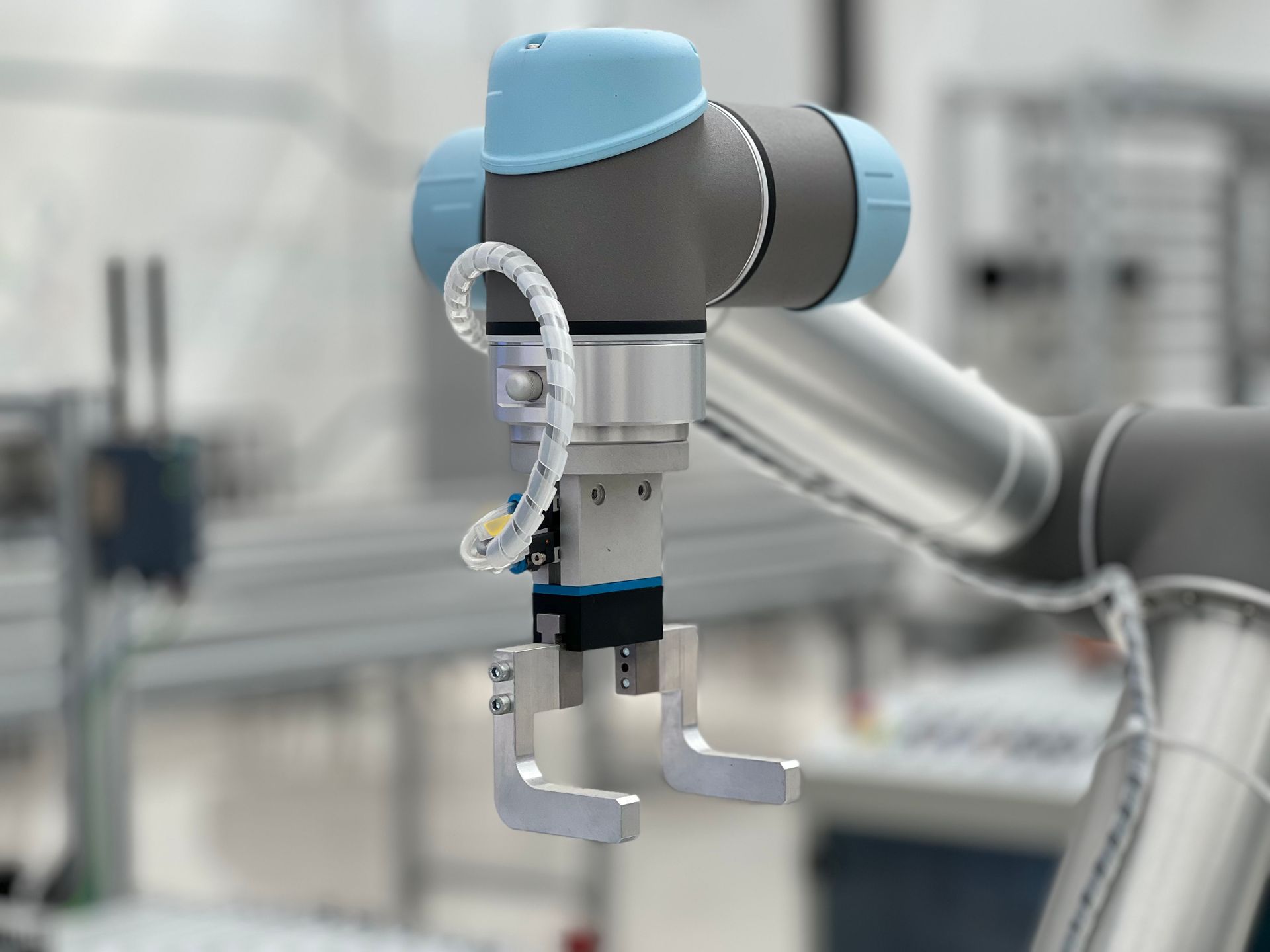 Collaborative robot arm at an assembly workstation