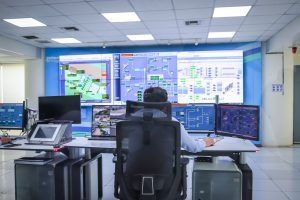 Industrial control room with SCADA monitoring screens