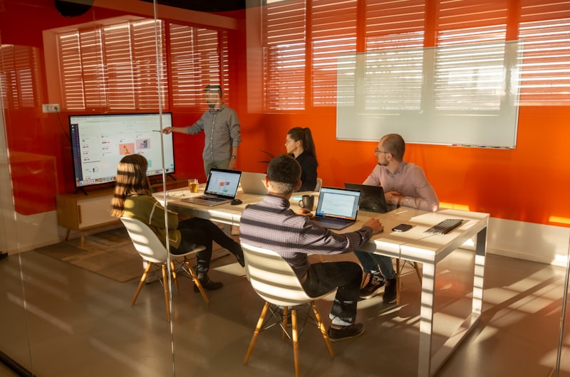 Team meeting around a table in a bright meeting room