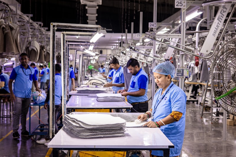 Workers on a garment production line in a manufacturing plant