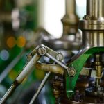 Technician aligning a motor and pump coupling